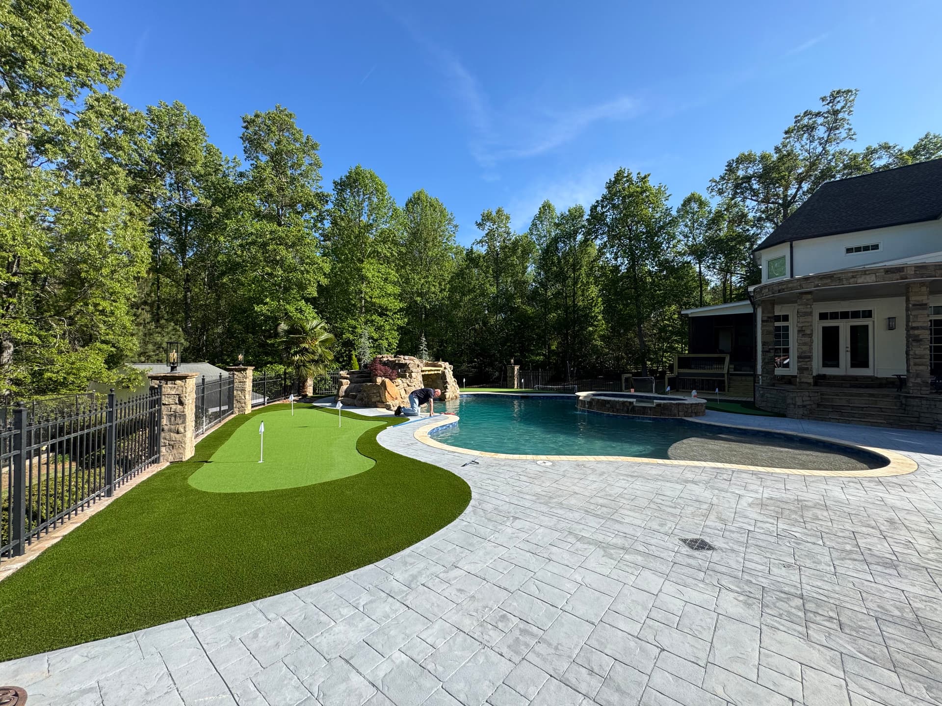 Backyard Putting Green Installation Next to Pool in Kennesaw image