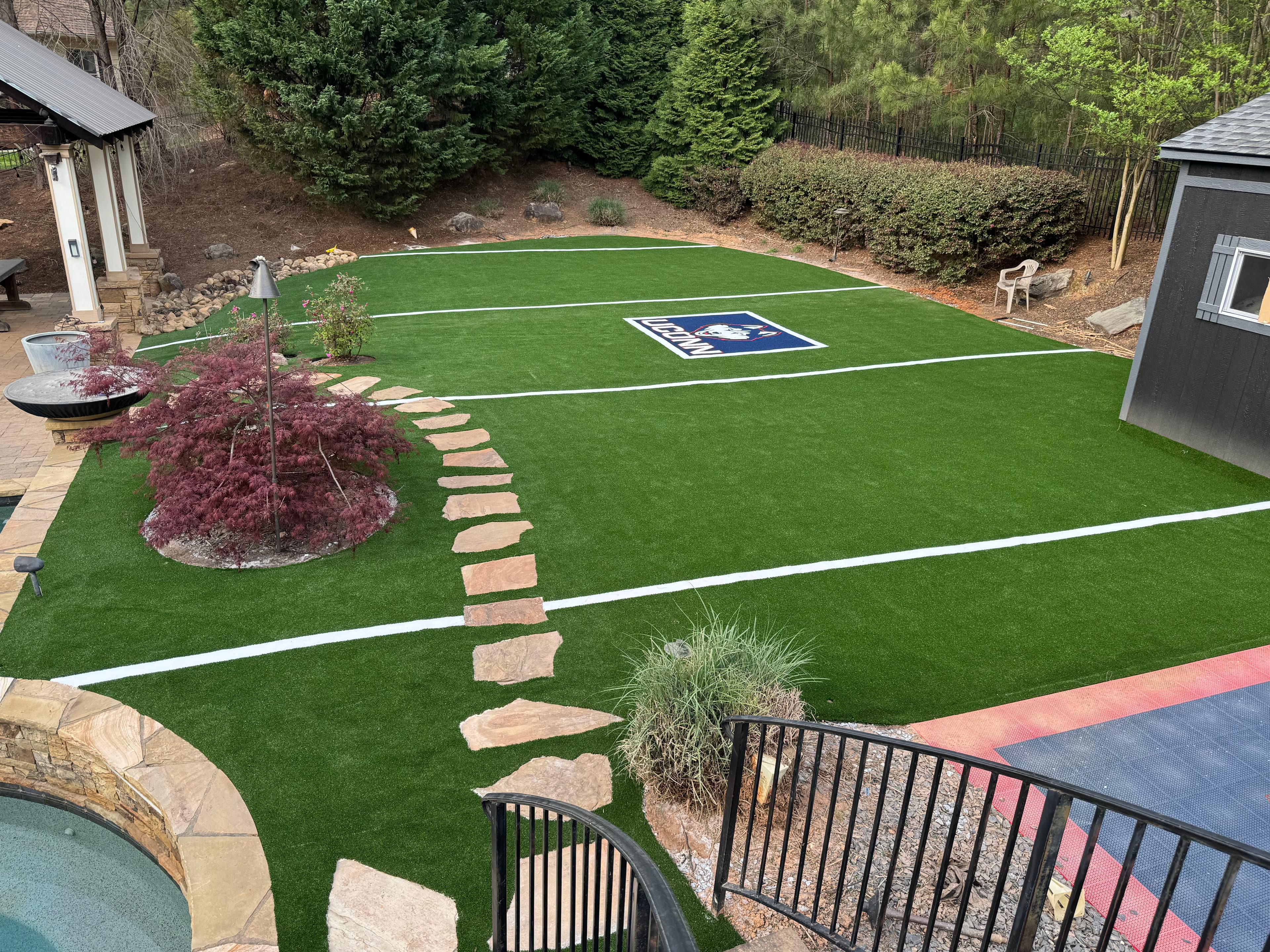 Project Backyard Mini Football Field with Custom UConn Logo Turf image