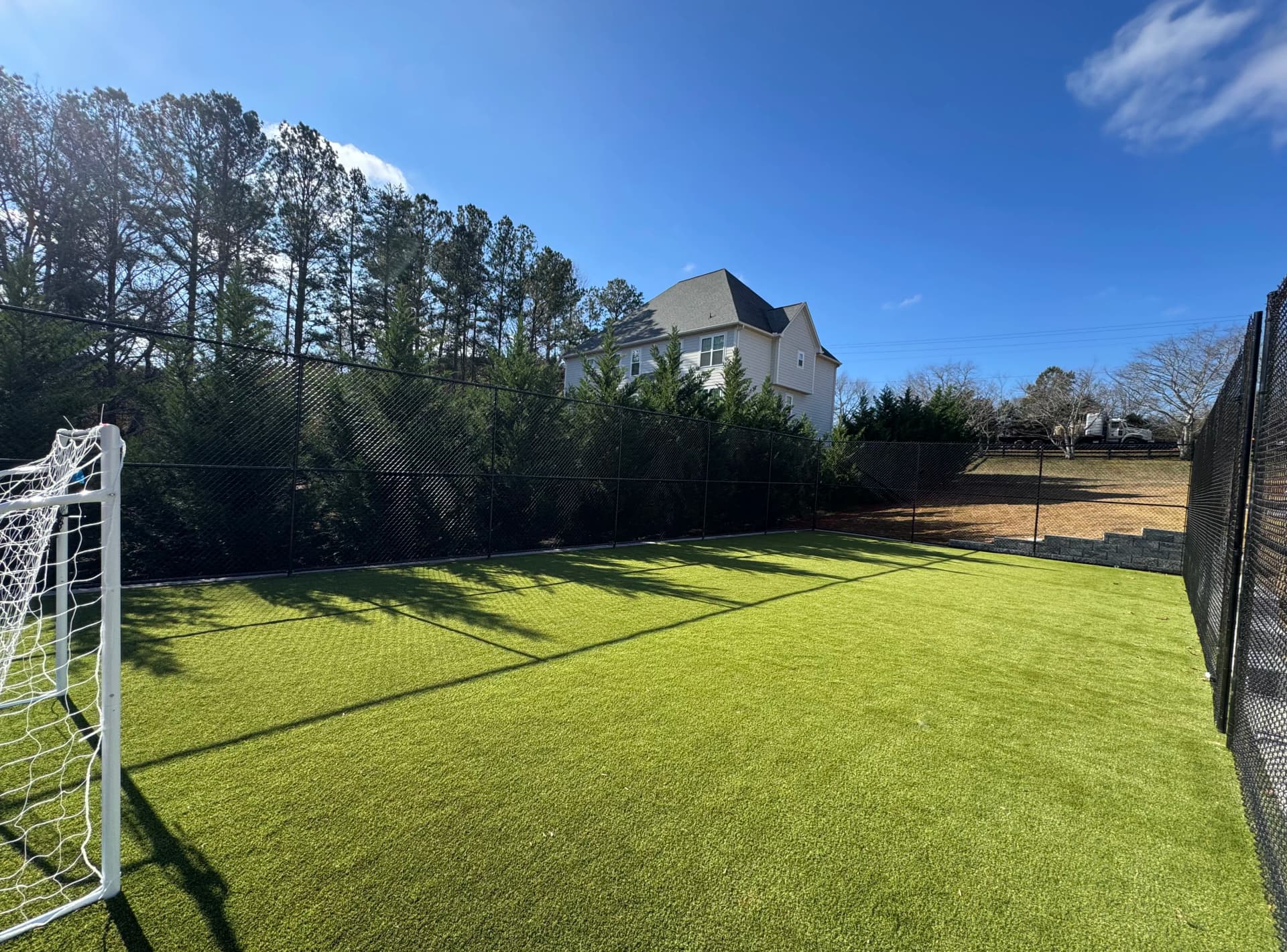 Gallery photos for Backyard Soccer Court With Artificial Turf and Full Enclosure: Image #1